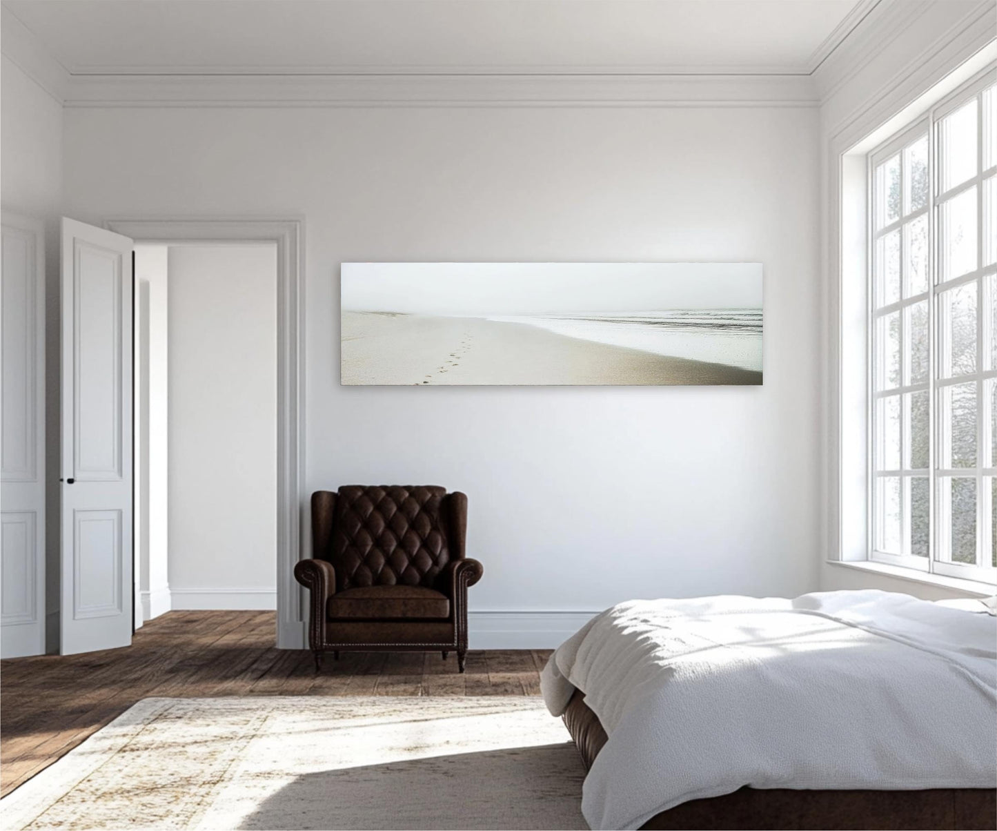 a bedroom with a bed, chair, and large window