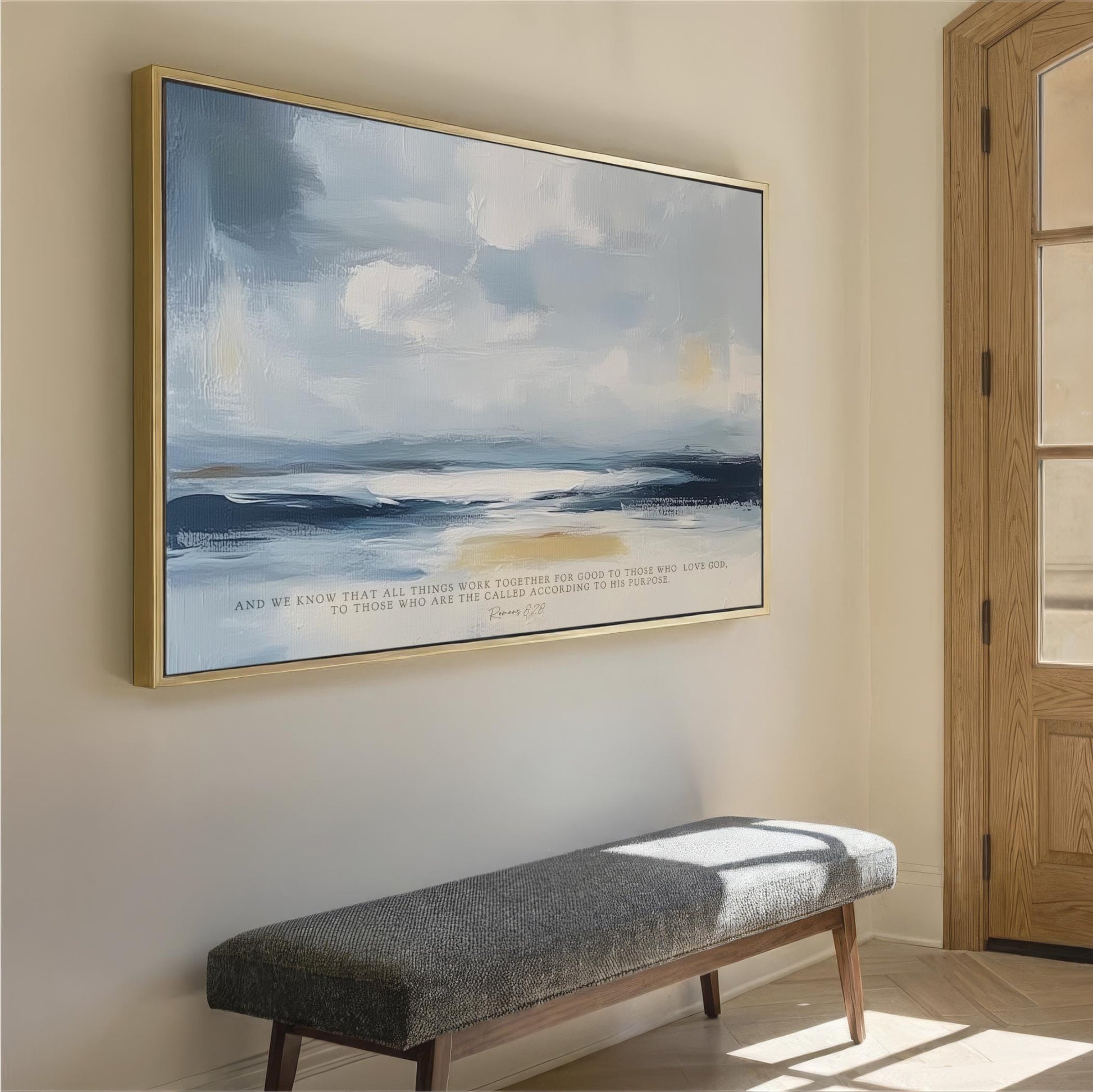 a large painting of a serene landscape hanging on a wall, with a wooden bench positioned in front of it.