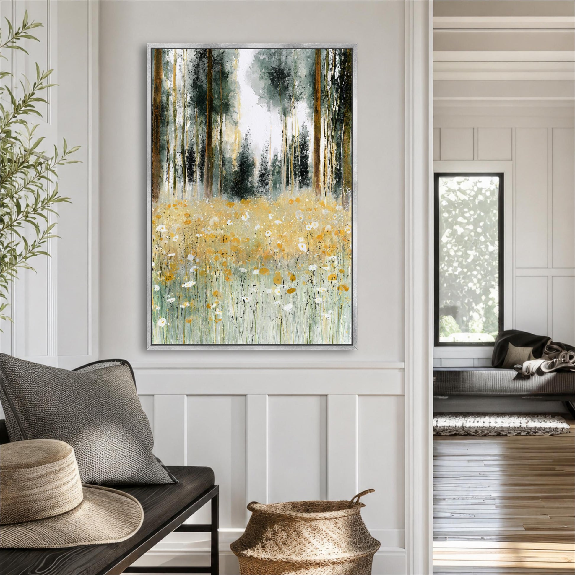 a living room with a large painting of a field of flowers hanging on the wall. The painting has a green and yellow color scheme, depicting a serene and natural landscape. The room is furnished with a couch, a wicker basket, and a hat, creating a cozy and inviting atmosphere.