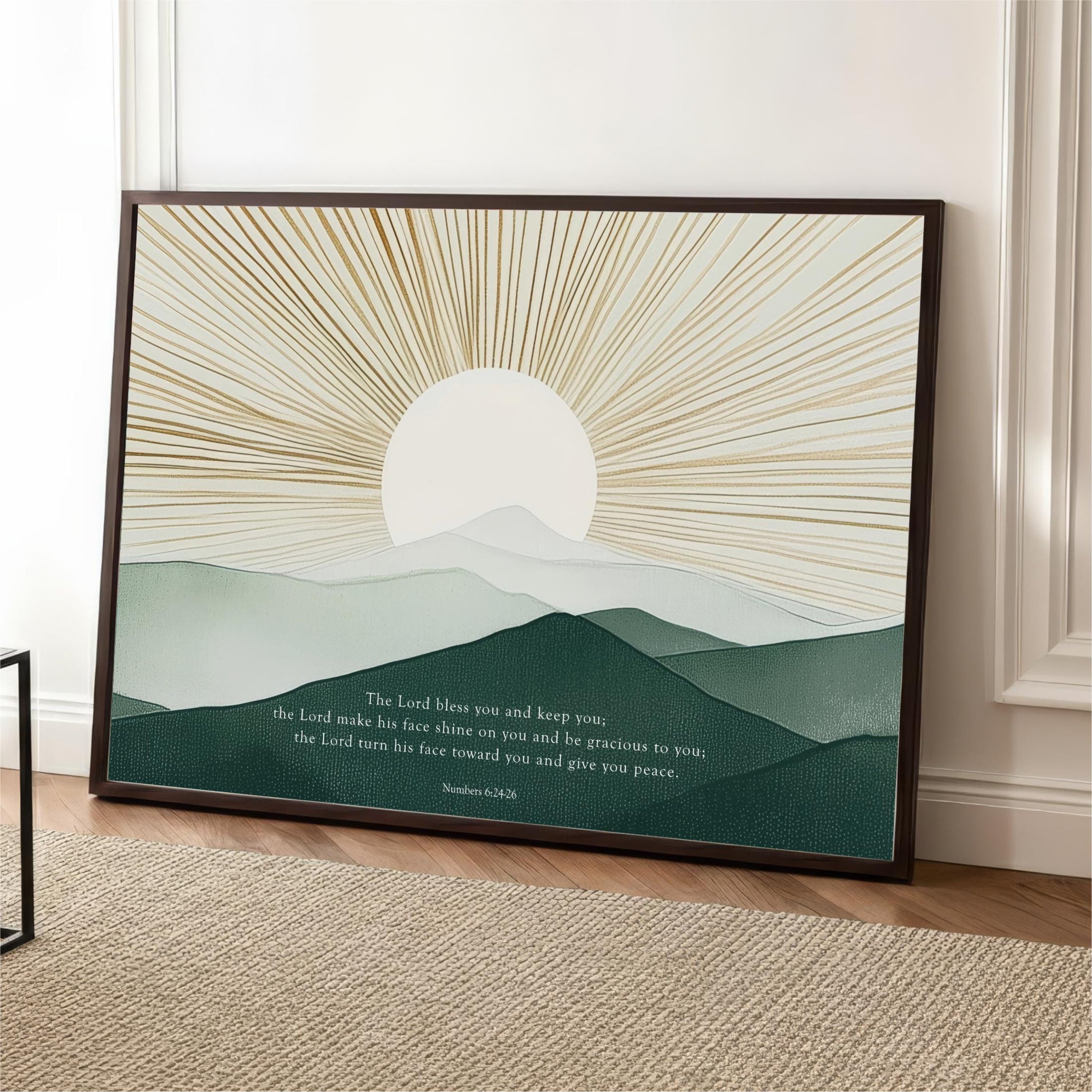 The image is a framed print featuring a serene landscape with mountains and a sunburst design. The text below the image reads "The Lord makes you and keep you, the Lord makes his face towards you and begrudgingly to you, the Lord turns his face towards you and gives you peace."
