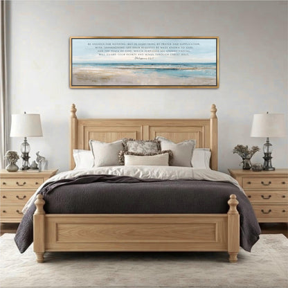 a serene bedroom setting with a large wooden bed, a wooden headboard, and a framed painting above it. The bed is adorned with a gray comforter and white pillows, creating a cozy and inviting atmosphere. The painting, which appears to be a religious or inspirational message, adds a touch of thoughtfulness and tranquility to the room. The overall scene conveys a sense of peace and comfort, with the bed as the focal point of the space.
