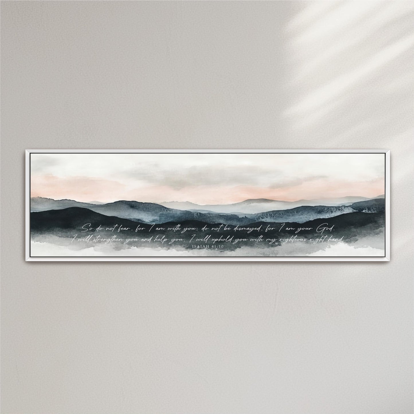 A framed watercolor painting depicting a serene mountain landscape with a text overlay that reads "So do not fear, for I am with you, but I am not destroyed for you are my God. I will strengthen you and help you, I will hold you with my righteous right hand."