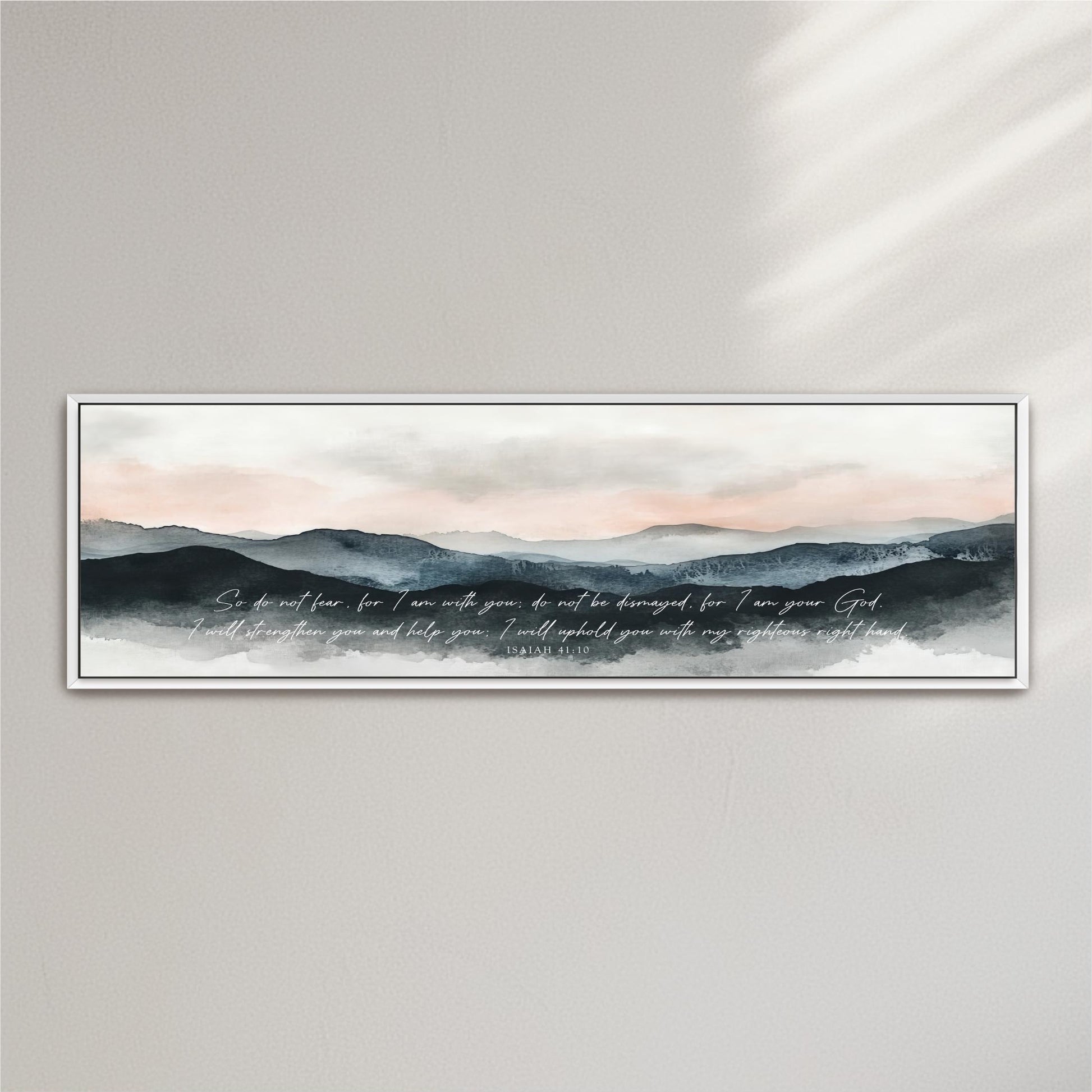 A framed watercolor painting depicting a serene mountain landscape with a text overlay that reads "So do not fear, for I am with you, but I am not destroyed for you are my God. I will strengthen you and help you, I will hold you with my righteous right hand."