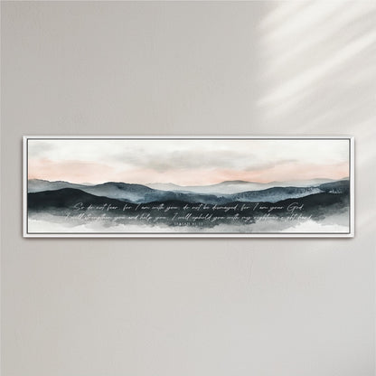 A framed watercolor painting depicting a serene mountain landscape with a text overlay that reads "So do not fear, for I am with you, but I am not destroyed for you are my God. I will strengthen you and help you, I will hold you with my righteous right hand."