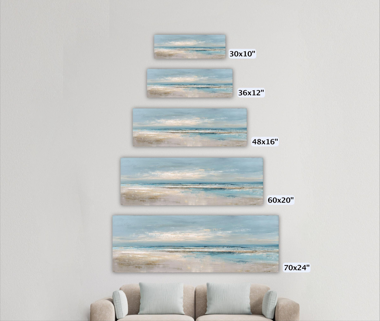 A wall with five identical paintings of a beach scene, each varying in size from 30x10" to 70x24" and labeled with the corresponding size in inches.