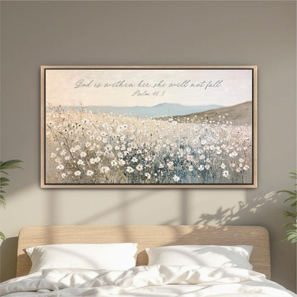 A framed painting of a field of flowers hangs on a wall above a bed with white pillows.