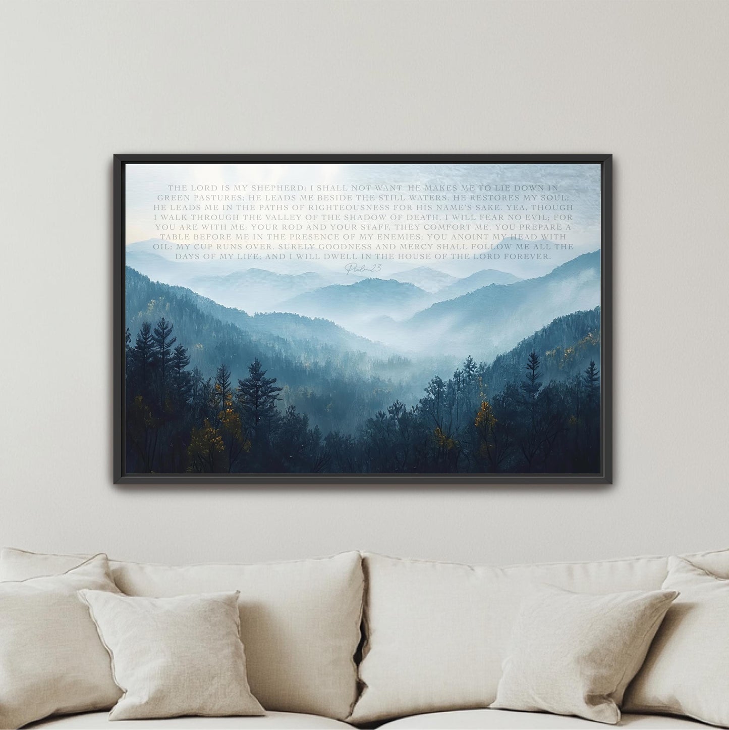 The image is a framed artwork hanging on a wall, depicting a serene mountain landscape with a dense forest in the foreground and a hazy, misty atmosphere in the background.