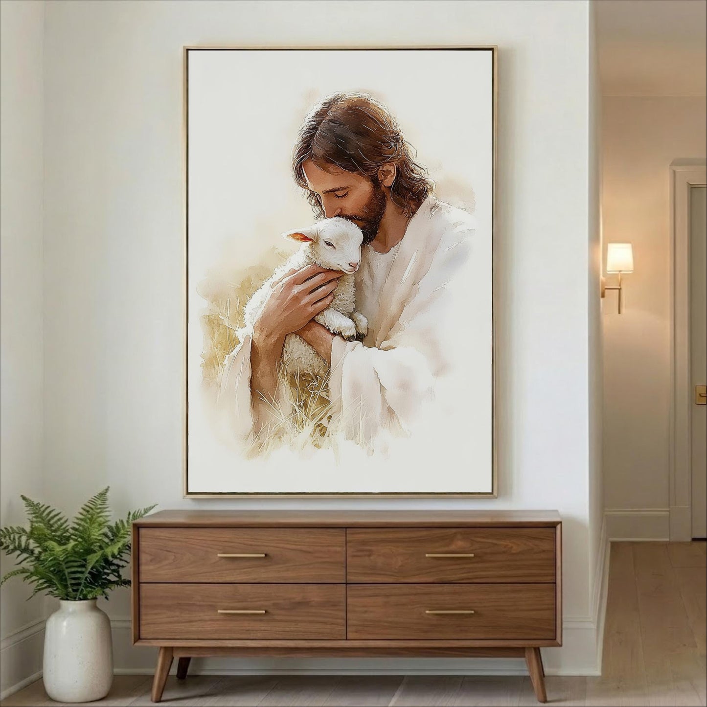 A framed painting of Jesus holding a lamb is displayed on the wall above a wooden dresser in a room.