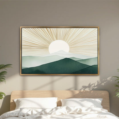 a large framed artwork depicting a serene landscape with a sun rising over a mountain range.