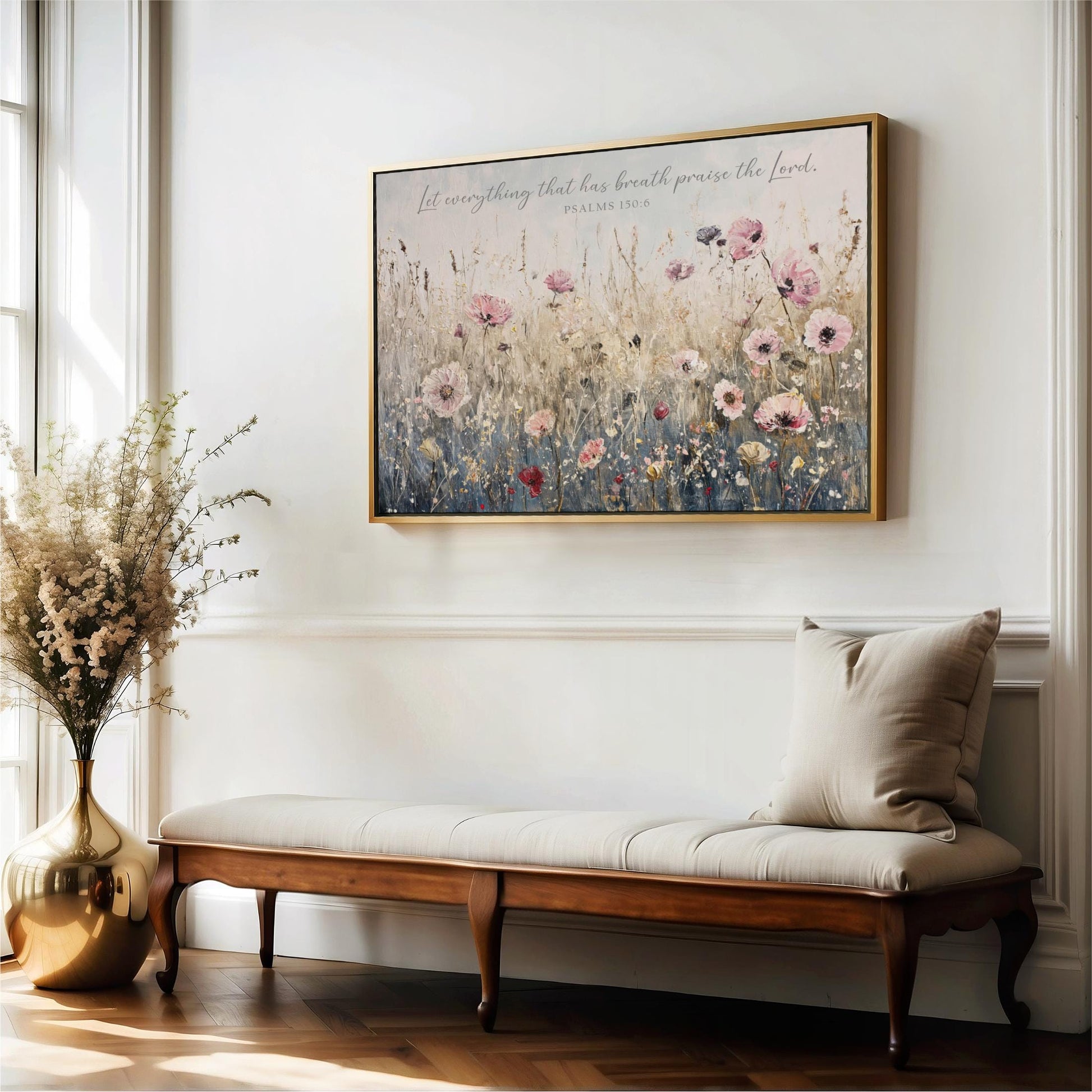 a serene indoor setting with a wooden bench, a vase of flowers, and a framed painting of a field of flowers hanging on the wall.