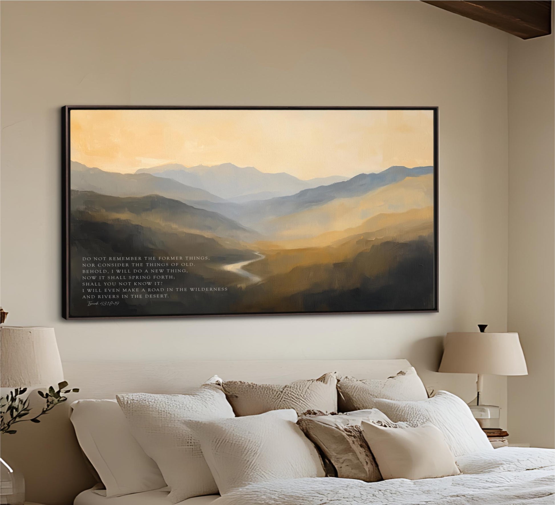 a large, framed painting of a mountainous landscape hanging on a wall above a bed with white bedding.