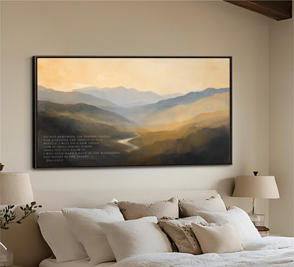 a large, framed painting of a mountainous landscape hanging on a wall above a bed with white bedding.