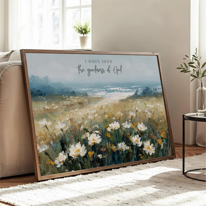 a large painting of a field of white flowers, with a text overlay that reads "I have seen the goodness of God".