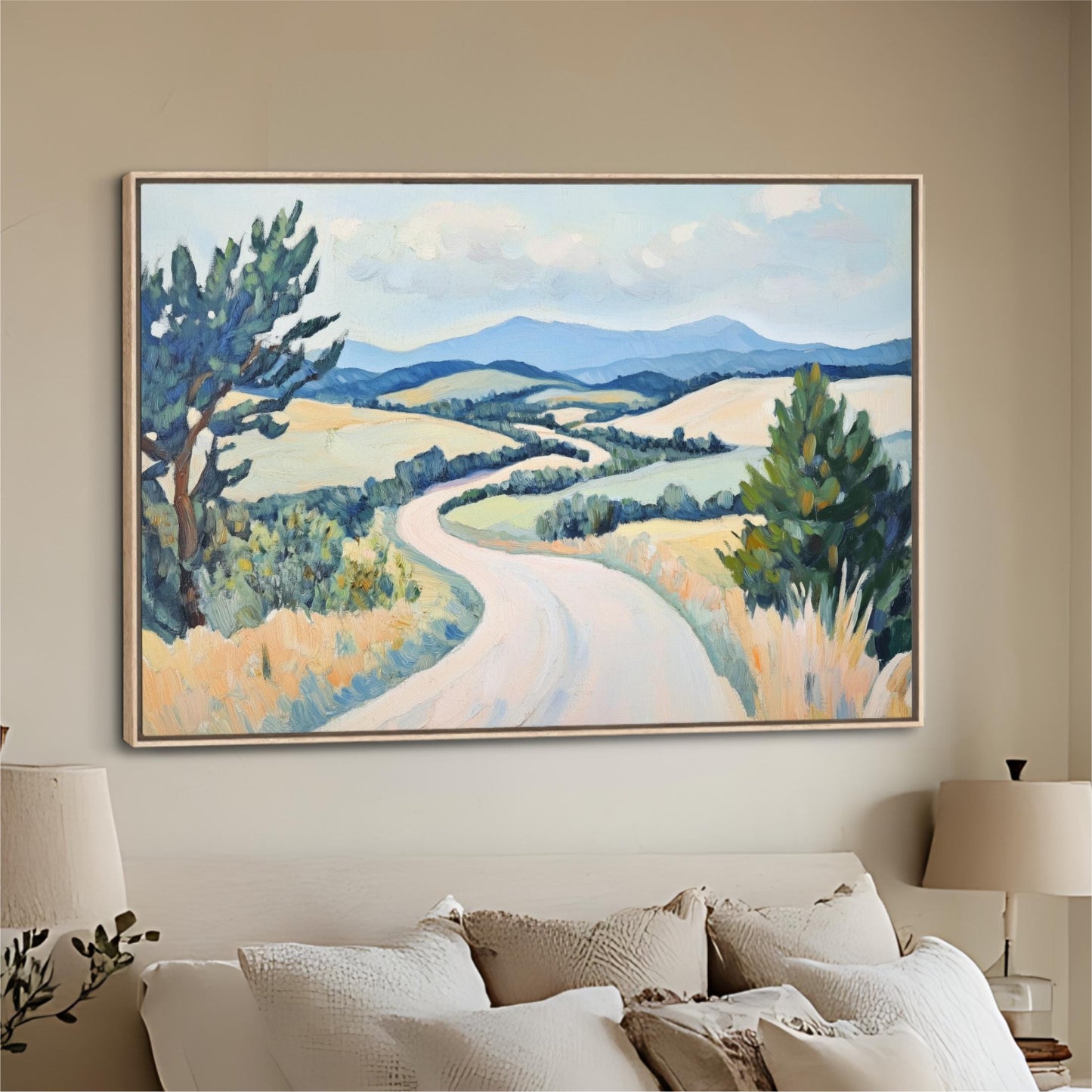 a large landscape painting hanging on a wall above a bed with white pillows.