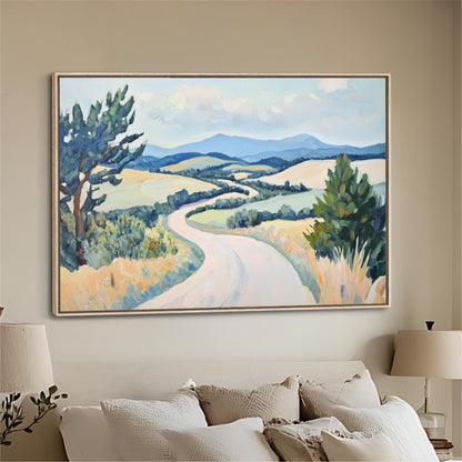 a large landscape painting hanging on a wall above a bed with white pillows.