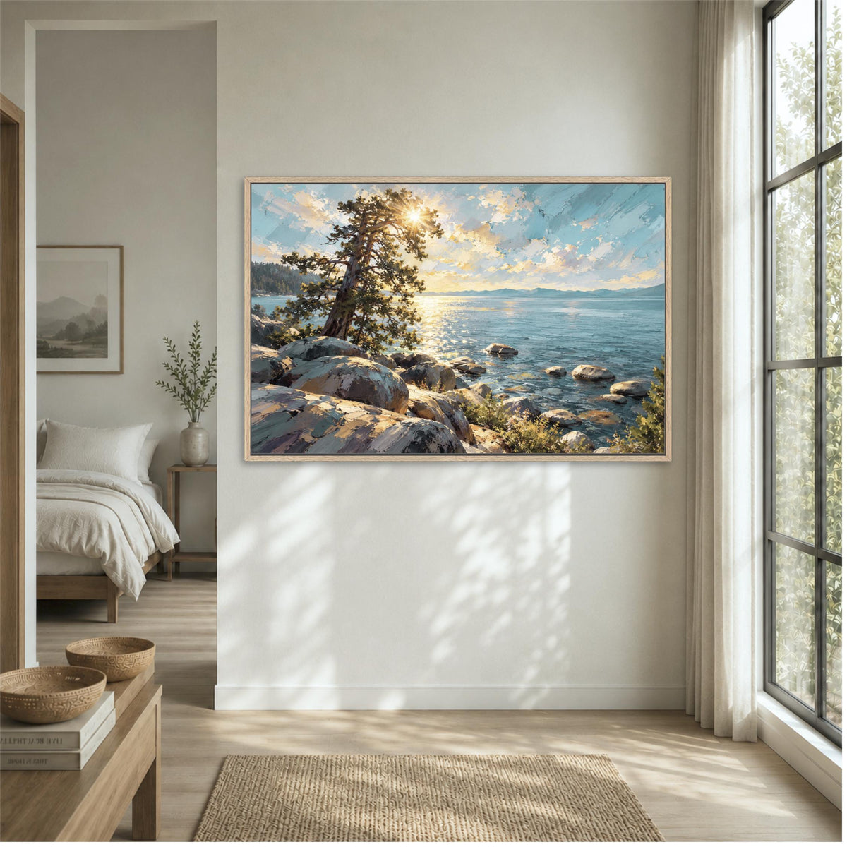 a large painting of a serene landscape with a rocky shore, a tree, and a body of water, hanging on a wall in a room with a window and a bed visible in the background.