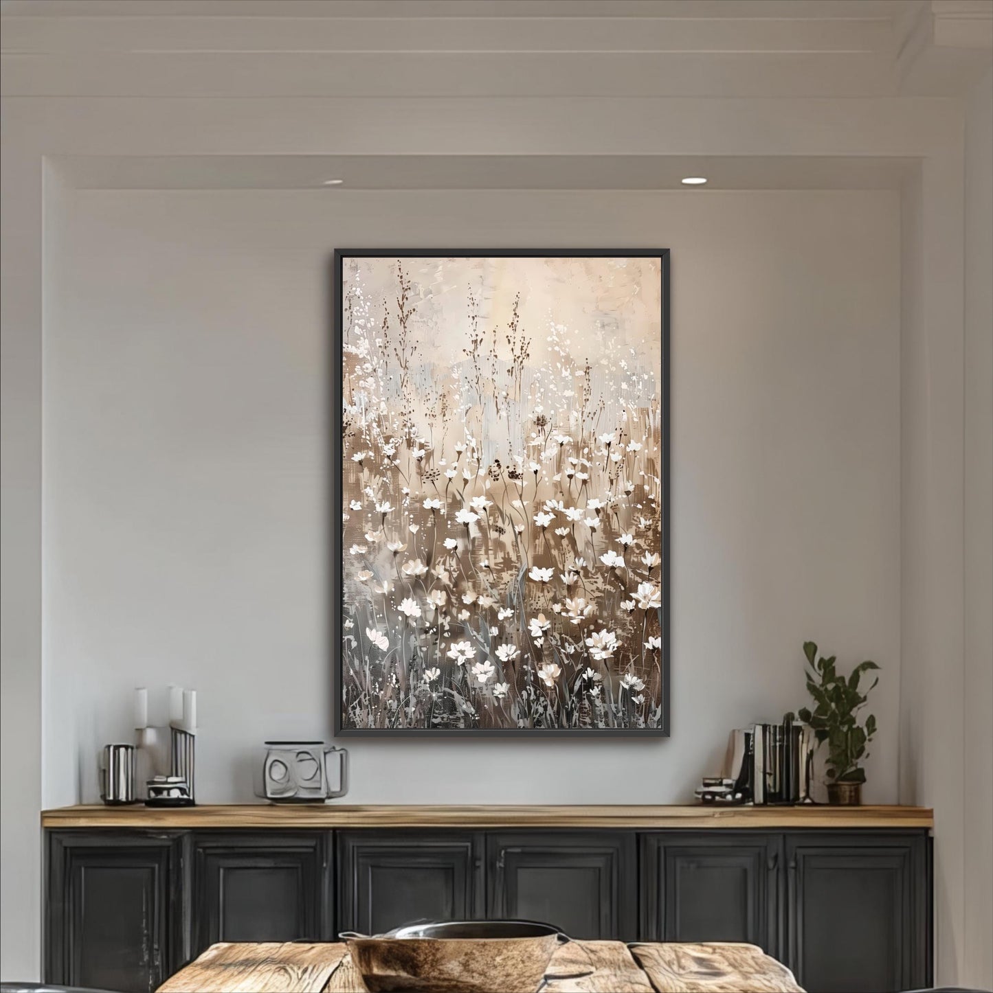 a large painting of a field of flowers hanging on a wall above a wooden cabinet.