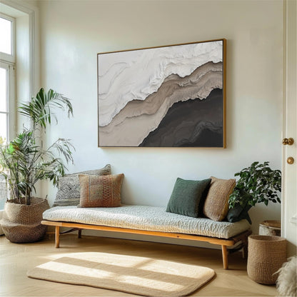 a living room with a large abstract painting hanging on the wall above a wooden bench with pillows. The room is decorated with potted plants and a rug, creating a cozy and inviting atmosphere.