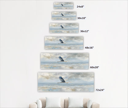 A series of framed artworks depicting a bird in flight over a body of water, with each frame showing a different size of the artwork.