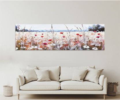 a living room with a couch and a painting on the wall