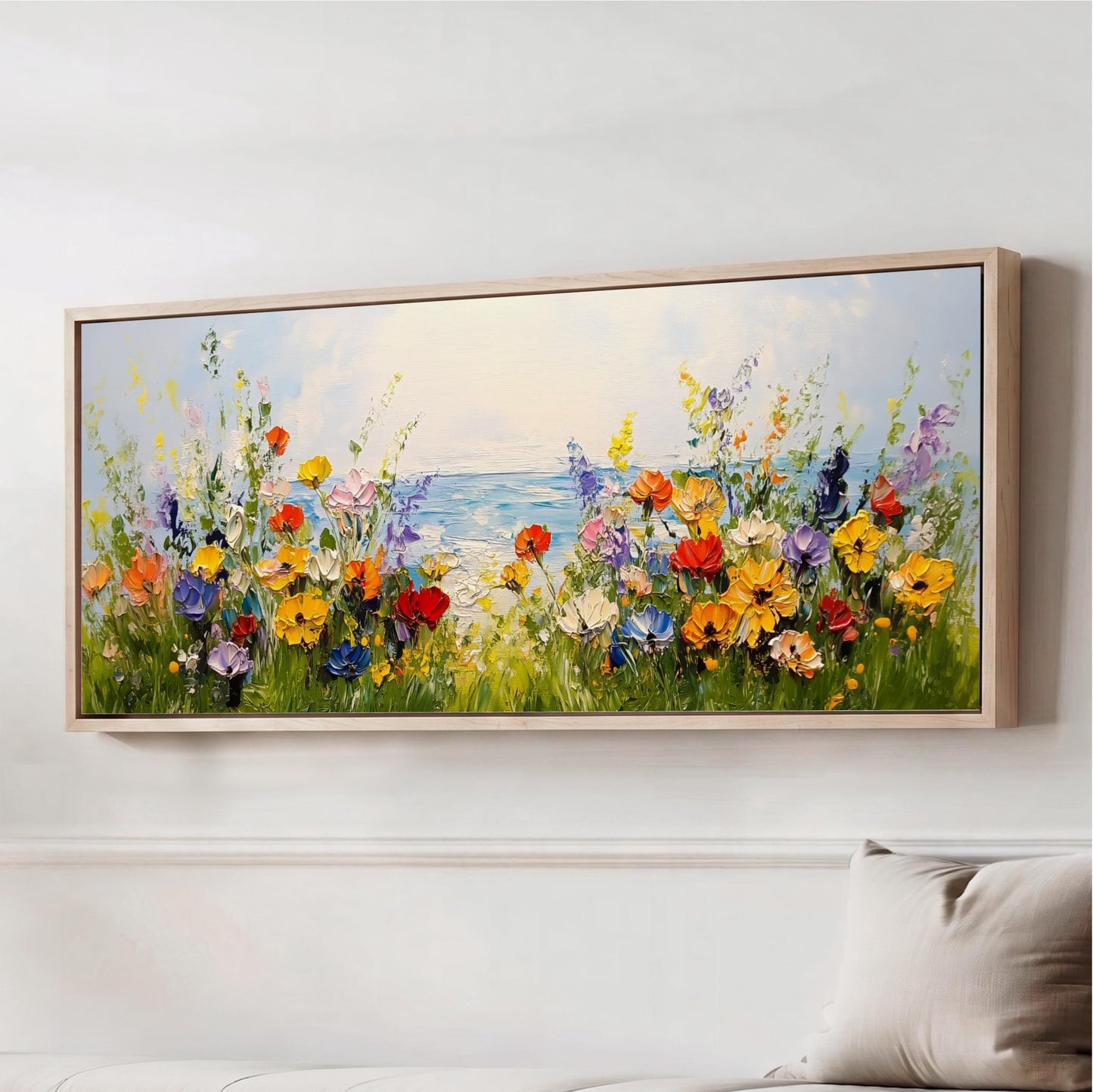 The image is a large painting depicting a vibrant field of colorful flowers, with a body of water in the background.