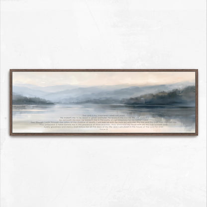 The image is a framed painting depicting a serene landscape with a body of water and mountains in the background.