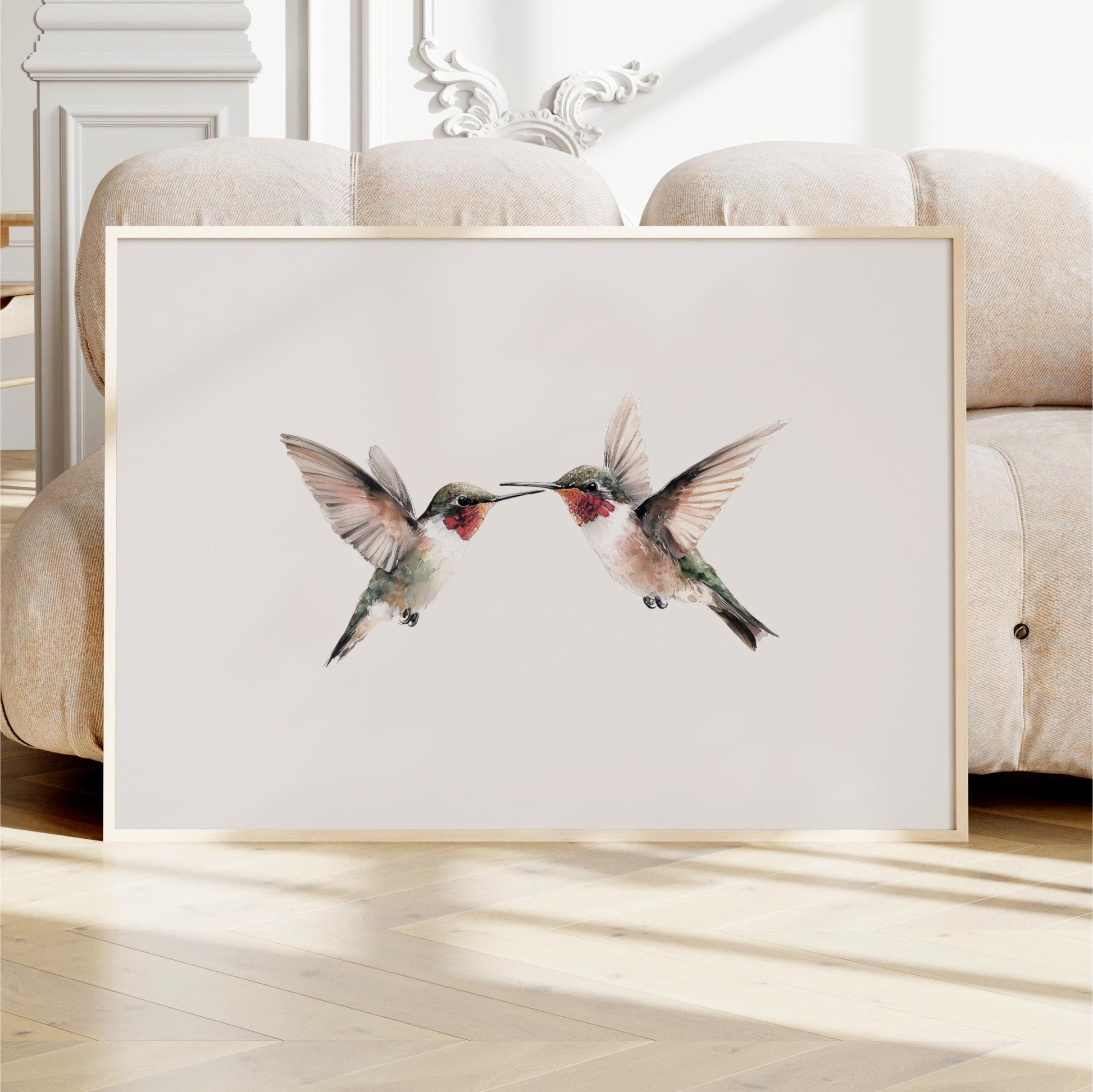two hummingbirds in flight, with their wings spread wide and their beaks touching, creating a sense of harmony and balance.
