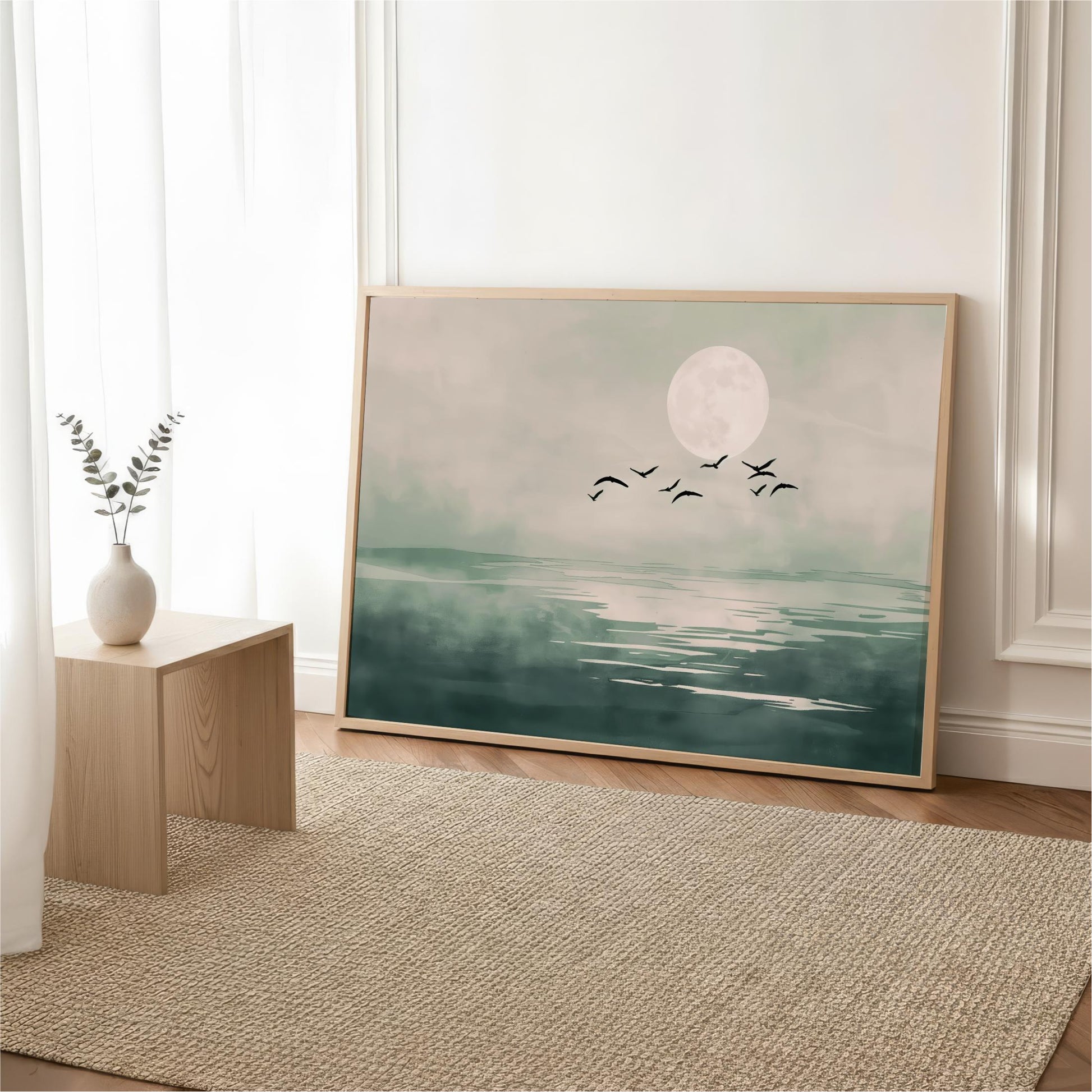 a large framed painting depicting a serene landscape with a full moon, birds flying over a body of water.