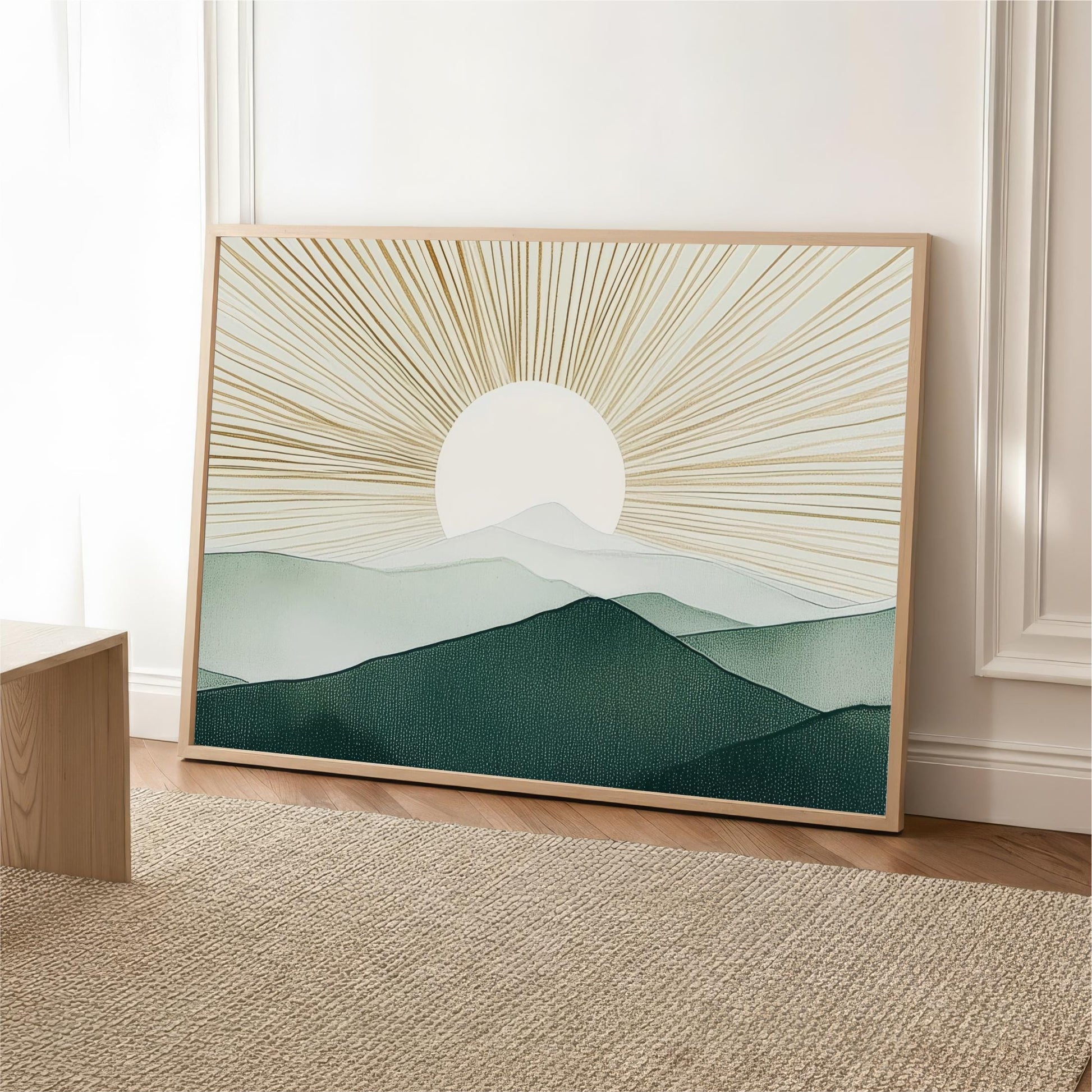 a large framed print of a landscape depicting a mountain range with a sun-like design in the center.