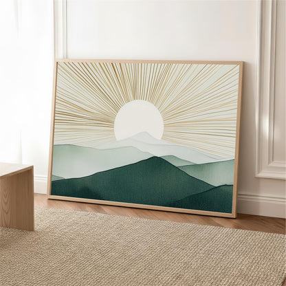a large framed print of a landscape depicting a mountain range with a sun-like design in the center.