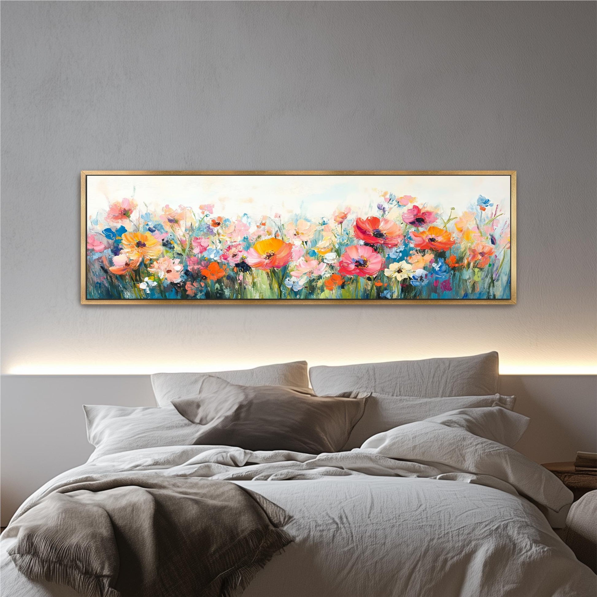 a large, colorful painting of a field of flowers hanging above a bed with white bedding.
