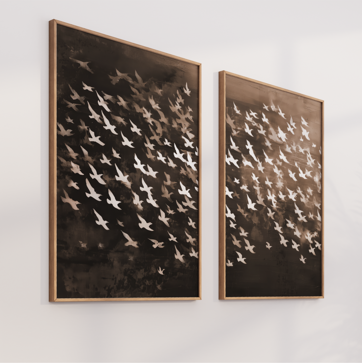 two framed artworks hanging on a wall, depicting a flock of birds in flight.