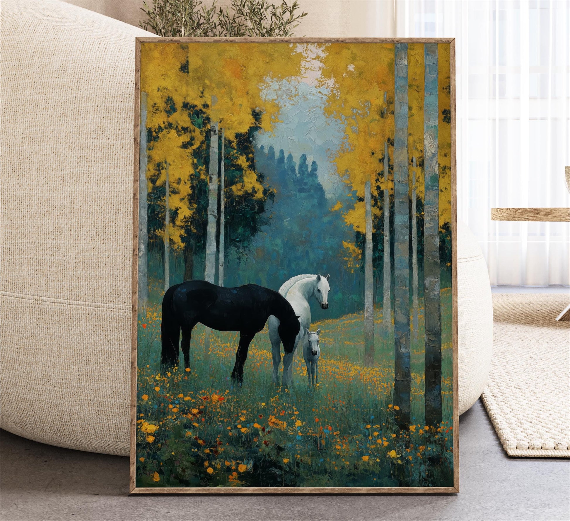 A framed painting depicting two horses standing in a field with yellow flowers, surrounded by tall trees with green foliage.