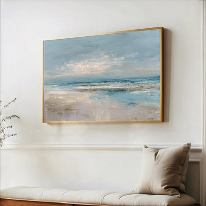 a large painting of a serene landscape hanging on a white wall above a wooden bench.