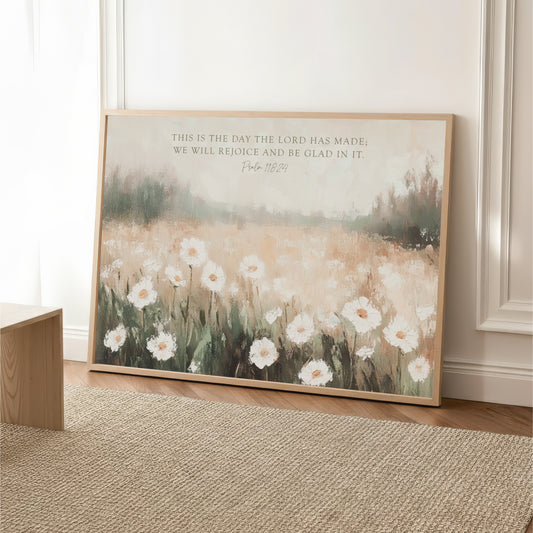 The image is a framed painting depicting a field of white flowers, with a text overlay that reads "This is the day the LORD was made. We will rejoice and be Glad in it. Psalm 18:24".