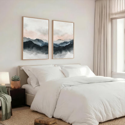 a serene bedroom with a large bed, white bedding, and two framed landscape paintings hanging above it. The paintings feature a mountain landscape with a cloudy sky, creating a calming and peaceful atmosphere in the room.