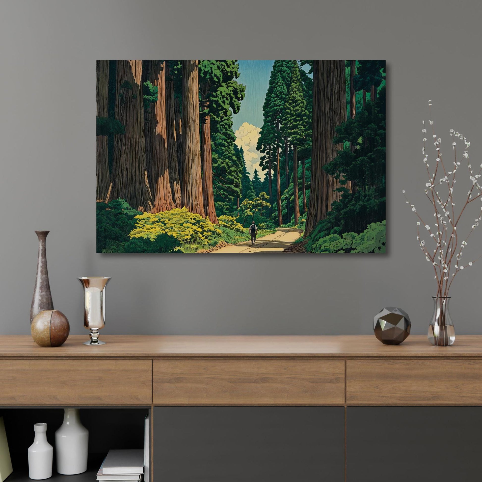 a large painting of a forest scene hanging on a wall above a wooden cabinet with decorative items on top.