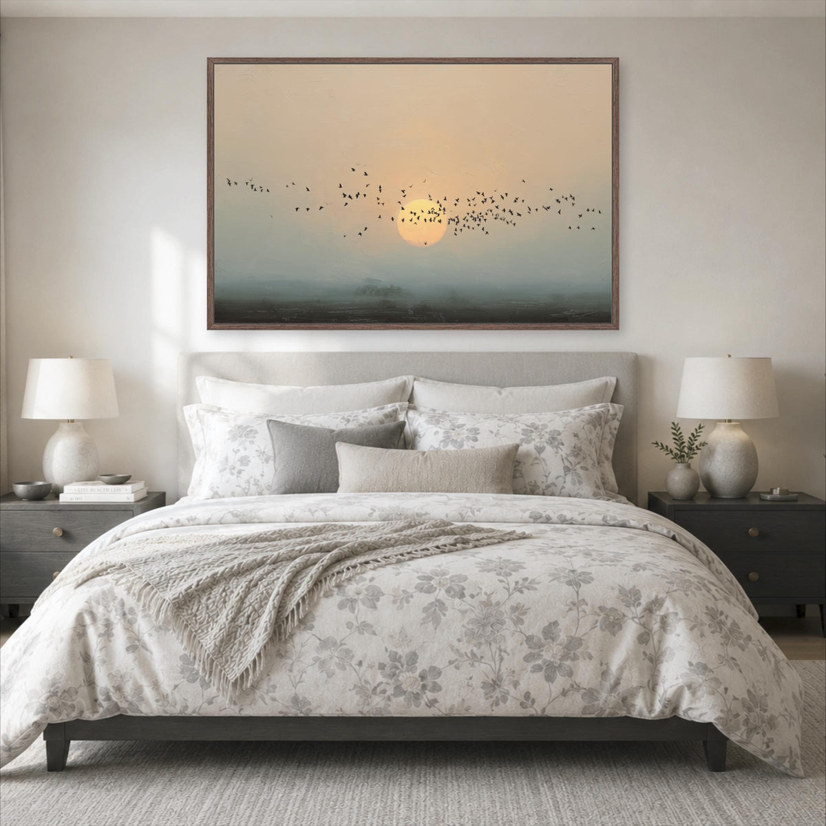 a serene bedroom scene with a large bed, a nightstand on each side, and a framed landscape painting hanging above the bed.