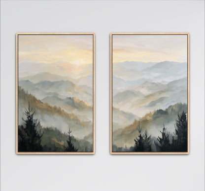 two framed landscape paintings depicting a serene mountain scene with trees and rolling hills.