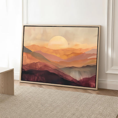 a large, framed painting of a mountainous landscape with a sunset in the background.
