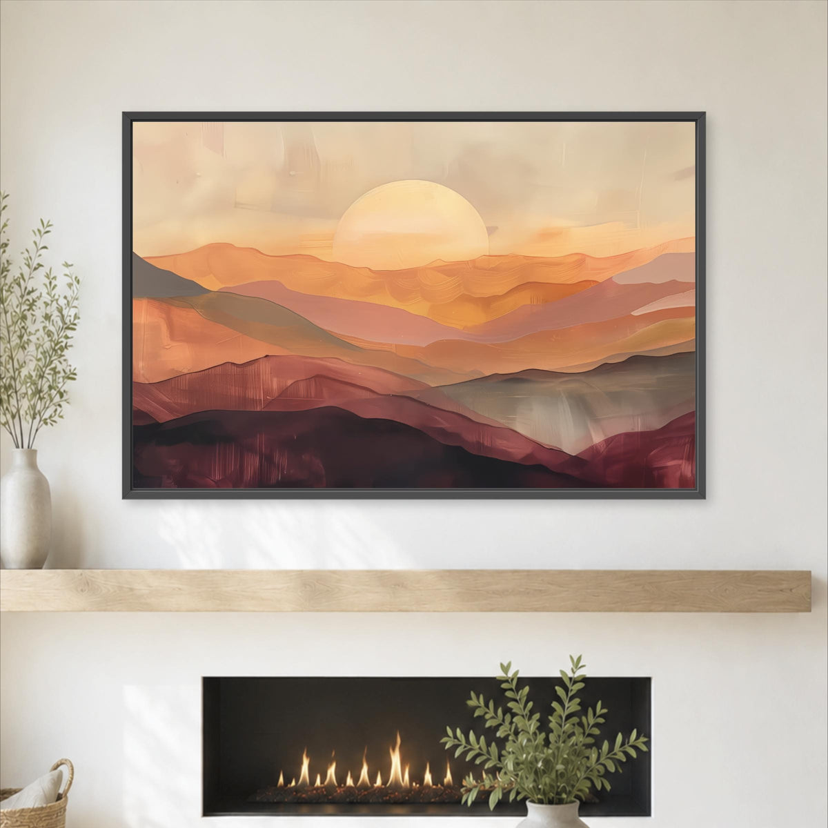 a large framed painting of a sunset over mountains, hanging on a wall above a fireplace.