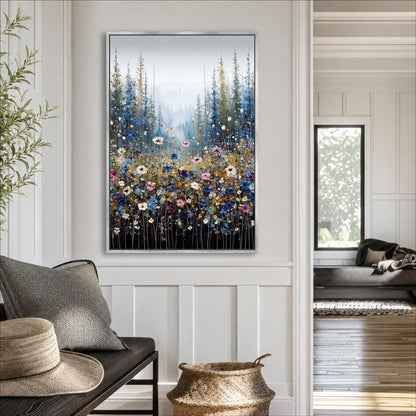 a large framed painting of a field of flowers hanging on a wall in a room with a wooden floor and white walls.