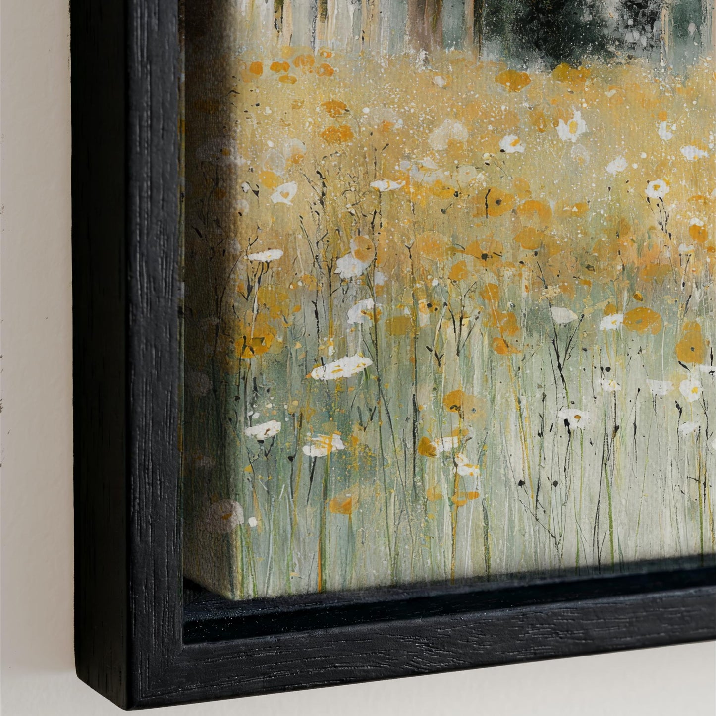 The image is a painting of a field of flowers, with a predominantly yellow and white color palette. The painting is framed in a black frame, which contrasts with the vibrant colors of the flowers. The painting appears to be a close-up view of the artwork, showcasing the intricate details and textures of the flowers and the frame.