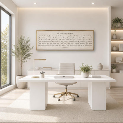 a modern, minimalist office space with a large window, white desk, and a framed text on the wall.