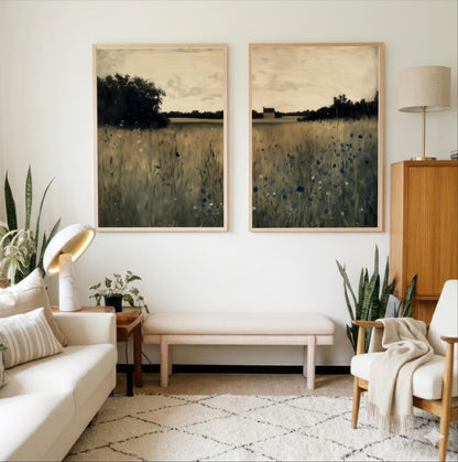 a cozy living room with a white sofa, a wooden side table, and two framed landscape paintings on the wall.