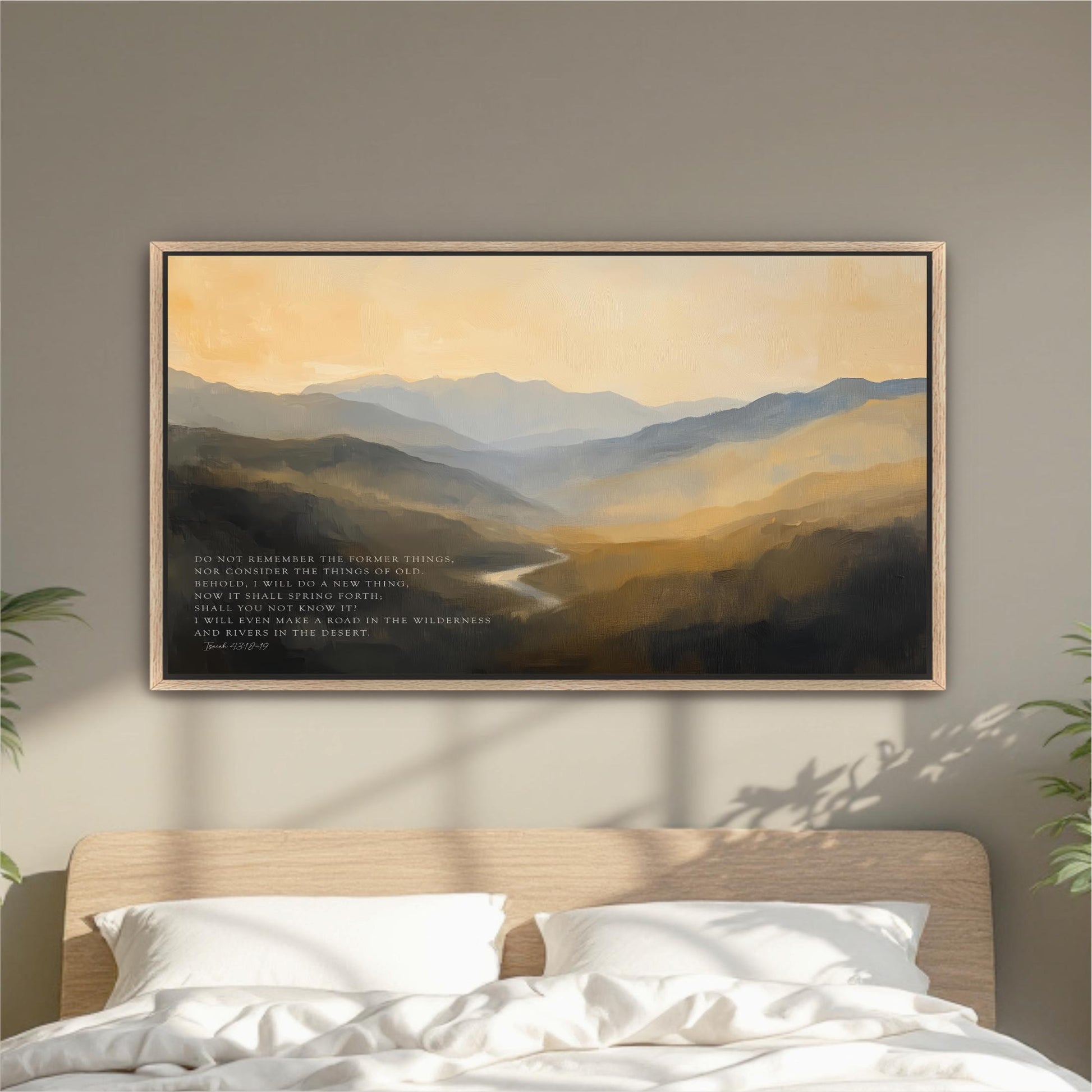 a large landscape painting hanging on a wall above a bed with white pillows.