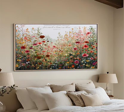 a large, colorful painting of a field of flowers hanging on a wall above a bed with white pillows and a beige headboard.