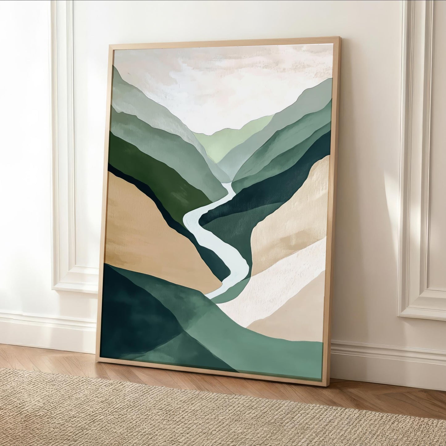 a large, framed painting of a mountain landscape with a winding river in the center. The painting has a predominantly green and brown color scheme, with the river flowing through the mountains. The painting is displayed on a white wall, and there is a rug in front of it.