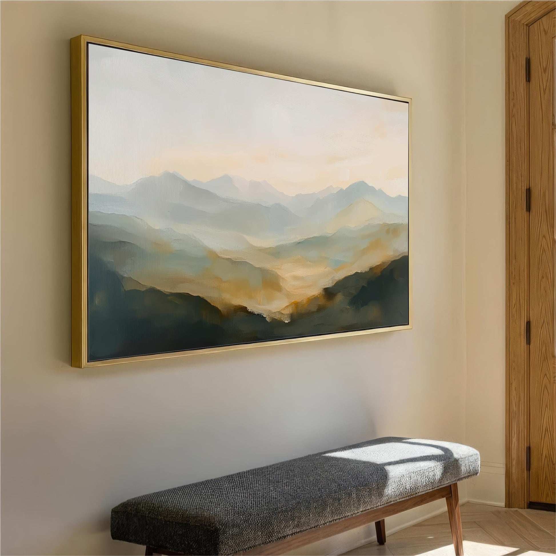 a large landscape painting hanging on a wall, with a wooden bench placed in front of it.
