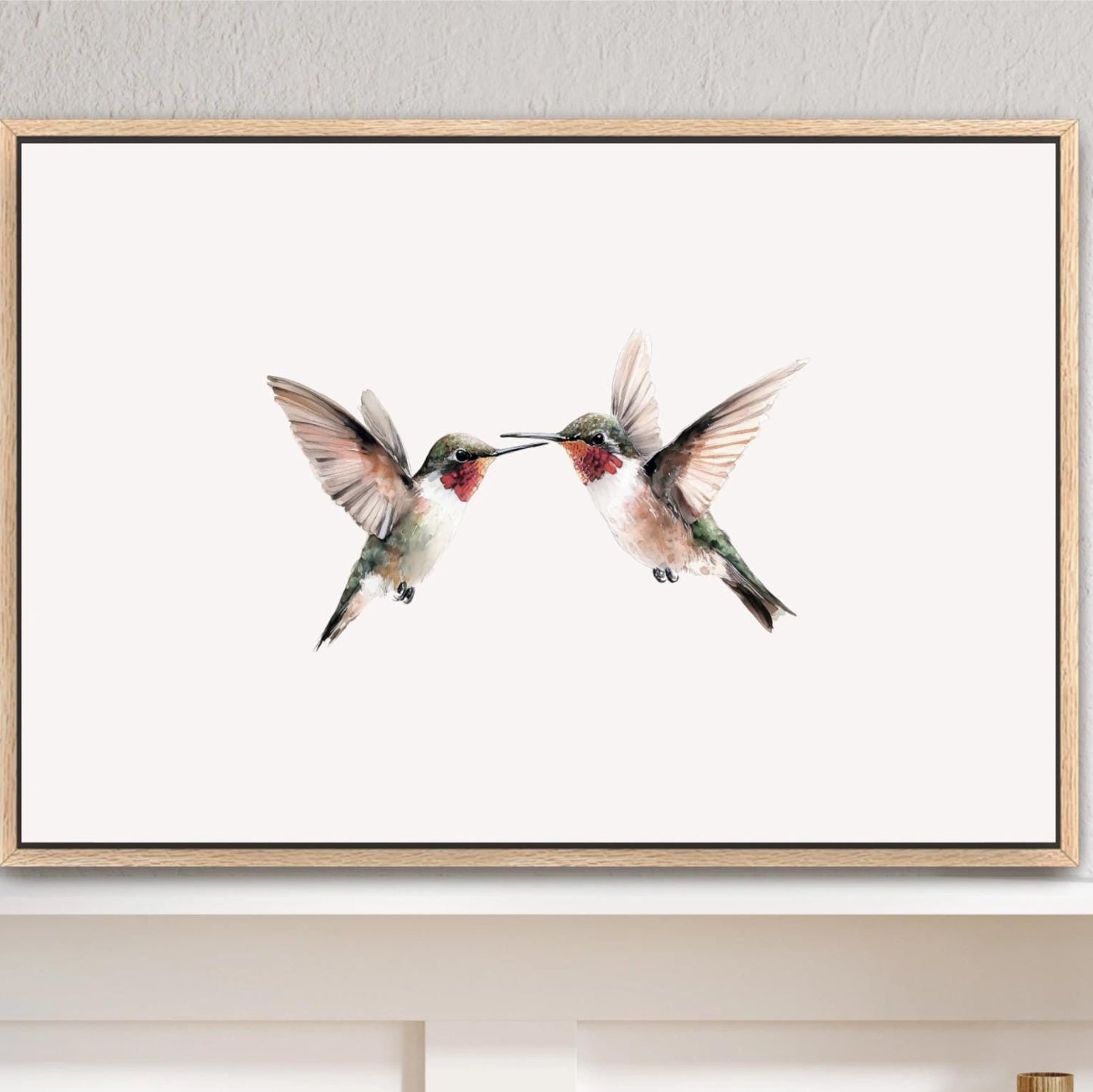 a framed painting of two hummingbirds in mid-flight, with their beaks touching, against a white background. Hummingbirds Art Print, Vintage Framed Artwork, Ruby Throated Sage Green Watercolor Canvas, Minimalist Farmhouse, 2 Birds in Flight